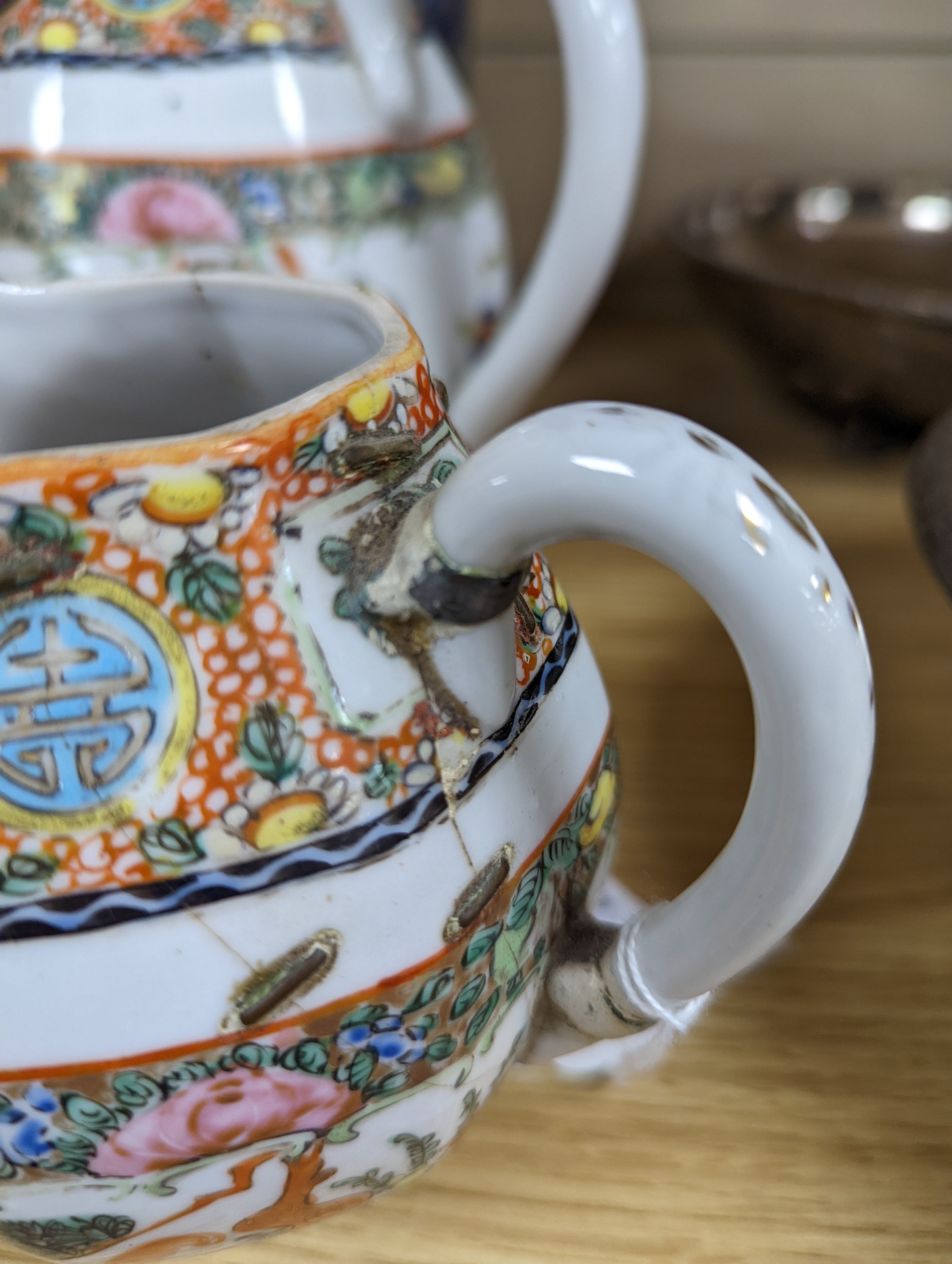A Chinese celadon glazed vase, 24cm and a Chinese famille rose teapot and matching cream jug, a.f.